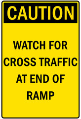 Garage sign and labels watch for cross traffic at end of ramp