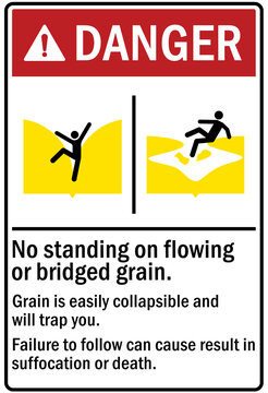 Grain bin hazard sign and labels no standing on flowing or bridged grain