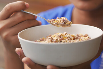  men eating granola Musli in a bowl, 