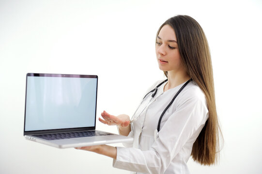 doctor holding tablet with blank screen for copy space. Female physician in uniform at hospital office. Medicine, healthcare and technology concept, copy space. High quality photo