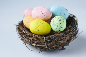 easter concept with multi color egg on pink background.