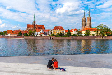 Couple looking at the Cathedral island in Wroclaw