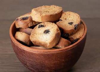 Delicious crispy crouton in a brown plate on a wooden table