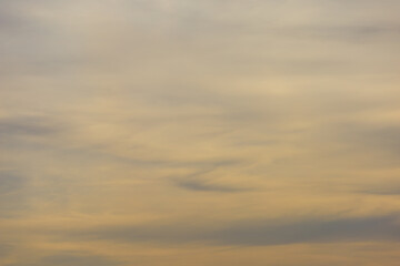 Naklejka na ściany i meble Sky background in windy weather. Backdrop clouds. Burnt evening color