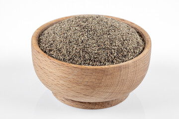 Powder black pepper on white background