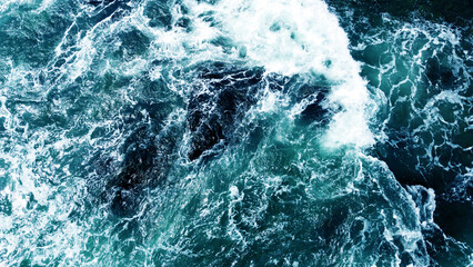 Fototapeta na wymiar Aerial view of the sea storm waves. Beautiful ocean wallpaper for tourism and advertising. Asian landscape, photo from the drone