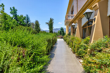 Valparaiso, Chile - January 2, 2023: Lush gardens and classic architecture amongst the vineyards in the wine region outside of Valparaiso, Chile
