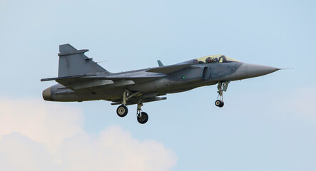 Military fighter jet on landing approach.