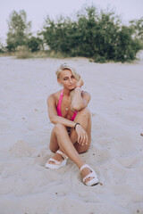Fototapeta premium girl on the beach relaxing on the beach woman in bikini
