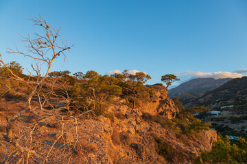Beautiful landscape. Coast of the island of Crete - Greece area of Lerapetra Eden Rock. Beautiful sky at sunrise over the sea.