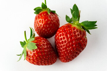 three strawberries isolated on white background