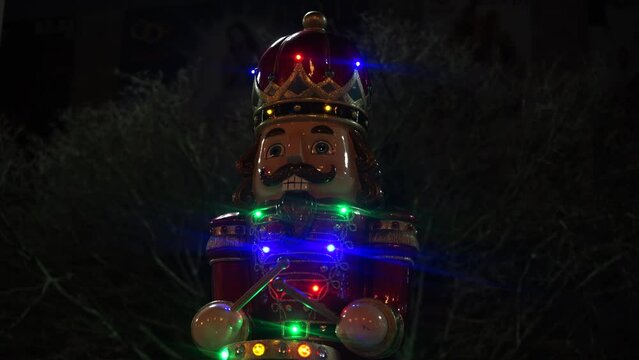 New Year's Nutcracker slowly beats the drums and smiles