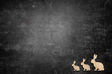Easter bunny family on concrete background