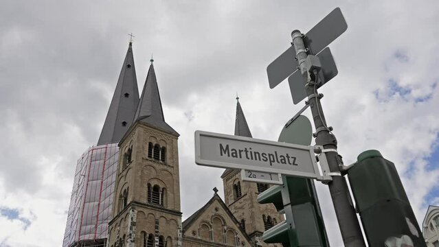Street sign Martinsplatz in front of Bonn Minster cathedral or Bonner Munster is the oldest roman catholic church in Bonn, Germany