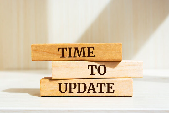 Wooden blocks with words 'Time To Update'.
