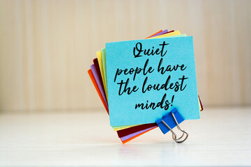 Quiet people have the loudest minds written on a memo at the office