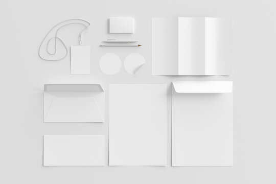 Blank corporate stationery set mockup on white background. View directly above