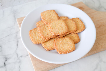 Potato chips biscuit on a white plate. Delicious crispy potato chips biscuits in plate. Space for text. Top view. Sweet potato buttermilk biscuits homemade for breakfast