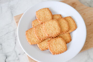 Potato chips biscuit on a white plate. Delicious crispy potato chips biscuits in plate. Space for text. Top view. Sweet potato buttermilk biscuits homemade for breakfast