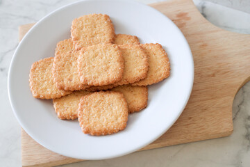 Potato chips biscuit on a white plate. Delicious crispy potato chips biscuits in plate. Space for text. Top view. Sweet potato buttermilk biscuits homemade for breakfast