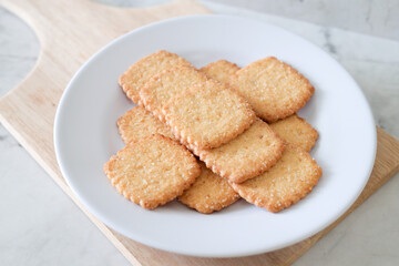 Potato chips biscuit on a white plate. Delicious crispy potato chips biscuits in plate. Space for text. Top view. Sweet potato buttermilk biscuits homemade for breakfast