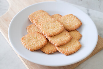 Potato chips biscuit on a white plate. Delicious crispy potato chips biscuits in plate. Space for text. Top view. Sweet potato buttermilk biscuits homemade for breakfast
