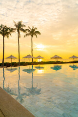 umbrella with bed pool around swimming pool with ocean sea background