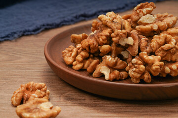 Fototapeta na wymiar plate of peeled walnuts
