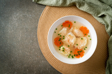 shrimp dumpling soup in white bowl