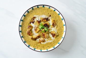 Afghani chicken in green curry or Hariyali tikka chicken hara masala