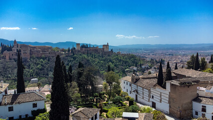 Fototapeta na wymiar Sacromonte gypsy neighborhood with panoramic landscape and blue sky. Granada, Spain.