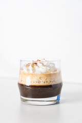 Irish coffee with whipping cram in glass