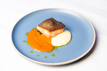 grilled salmon steak with mash potatoes and tomato sauce