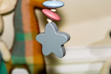 Baby crib mobile with a wooden star