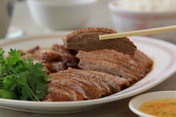 Steamed duck Thai cuisine in dish on white street food Thailand or food Chinese