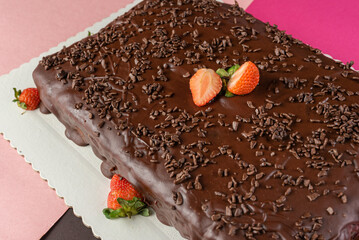 chocolate cake with strawberry and sprinkles