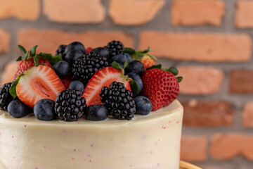Dessert - Cake covered with white chocolate and red fruits