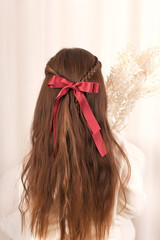 Elegant Fashion design accessories for girls. Hair bow on young woman hair