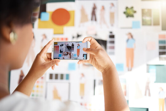 Woman hand taking picture of fashion designer moodboard, creative inspiration and planning a social media post. Artist or digital influencer photography, smartphone screen and clothes blog aesthetic