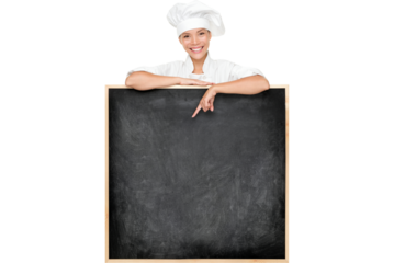 Chef showing menu sign blackboard happy. Empty menu chalkboard with copy space for text. Chef, baker or cook isolated cutout PNG on transparent background. Mixed race Asian Caucasian female model.