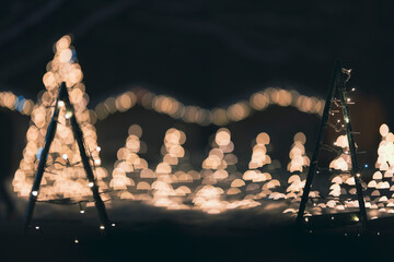 Christmas lights with a lot of odd shaped bokeh in the background