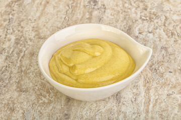 Organic mustard sauce in the bowl
