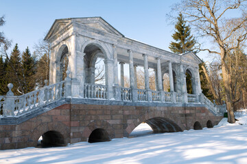 At the ancient Marble Bridge on a February afternoon. Catherine Park in Tsarskoye Selo....