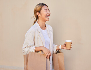 Coffee, shopping and laughter with an asian woman customer walking outside for a sale or bargain. Smile, retail and comic with a happy young female shopper outdoor for consumerism at a mall