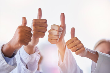 Doctor, group thumbs up and teamwork with hands, celebration and motivation in hospital for...