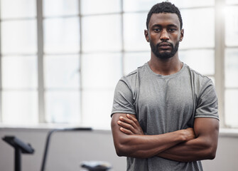 Black man, portrait and coach in gym with arms crossed for training, exercise and workout in...