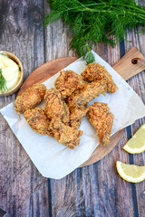 
 Crispy  deep fried   Chicken 
 Wings with cornflakes , ketchup and french fries . Breaded  with cornflakes chicken   wings. Junk fast food