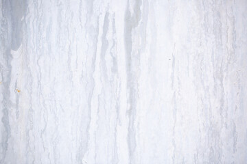 Texture of paint stains on the wall, cracked paint on an old metal surface. Sheet of silver metal with cracked and peeling paint, background for design with copy space.