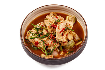 Top view of Thai Pork curry with Dill isolated on white background. That is local food of Isan in Thailand. This menu contains many vegetables such as dill, brinjal, chilli, lemongrass and red onions.