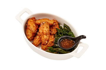 Crispy Fried Chicken wings with Crispy Basil Leaves and Chicken dipping sauce (sweet) isolated on white background. popular appetizers.